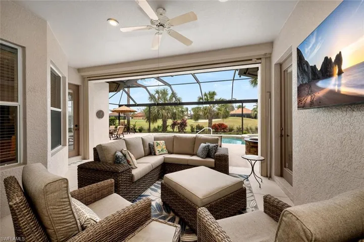 Sunroom featuring ceiling fan