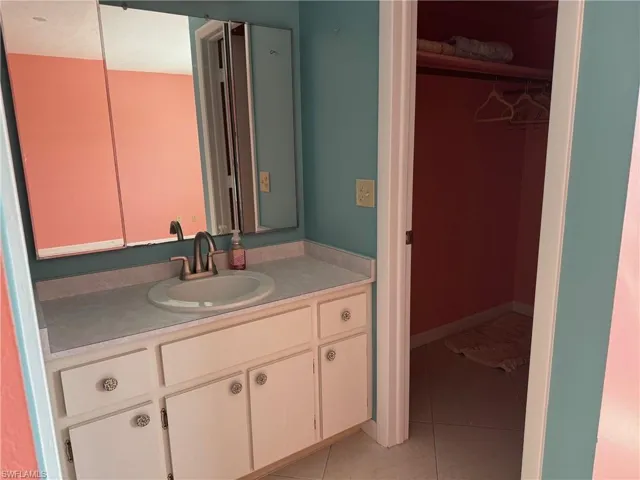 Bathroom featuring vanity and tile patterned floors