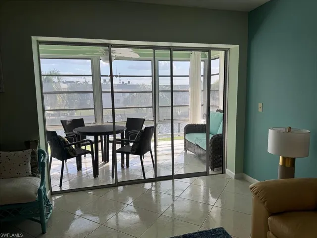 Dining room with a healthy amount of sunlight and light tile patterned floors