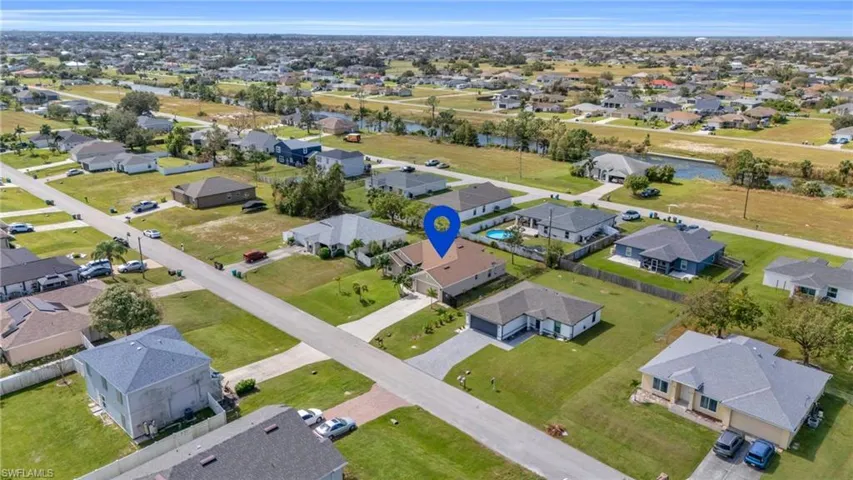 Drone / aerial view with a residential view and a water view
