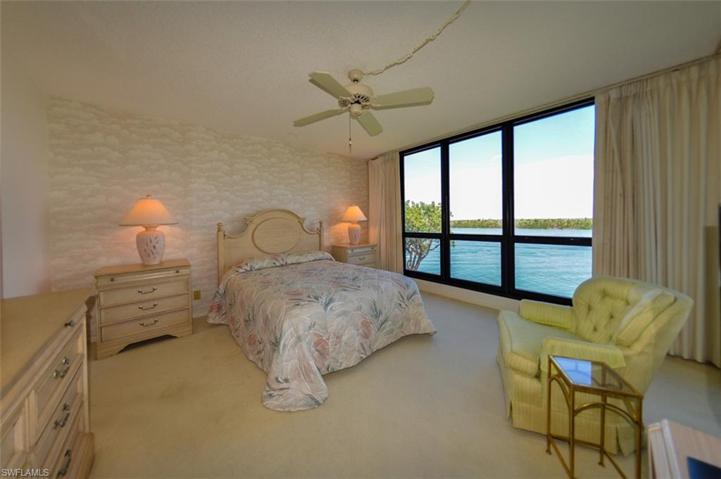 OWNER'S SUITE WITH FULL WATER VIEWS.  ENTRANCE TO EN-SUITE BATH IS TO MIDDLE LEFT.
