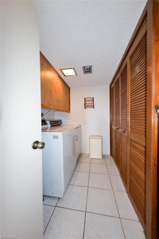 SPACIOUS LAUNDRY ROOM WITH LOTS OF STORAGE
