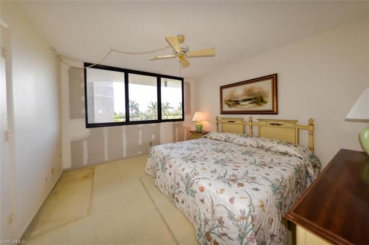 GUEST BEDROOM.  (ASSOCIATION REPAIRED WALL FROM STORM DAMAGE.)