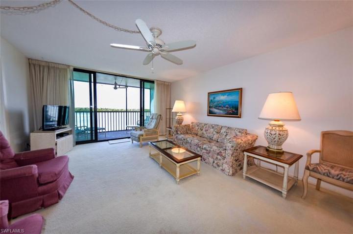 SPACIOUS LIVING AREA WITH DIRECT ESTERO BAY VIEWS.  IMPACT-RESISTANT SLIDING DOORS.  ENTRANCE TO OWNER'S SUITE IS AT MIDDLE LEFT.