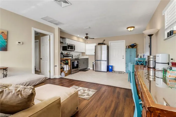 Living area featuring light wood finished floors and ceiling fan