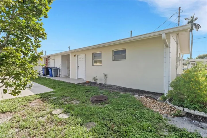 Back of property featuring a patio and stucco siding