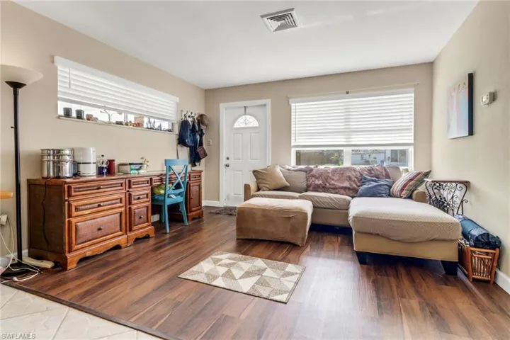Living room featuring baseboards and wood finished floors