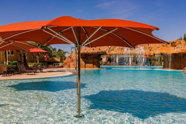Community pool with a patio