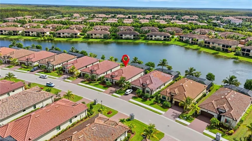 Aerial view of residential area with a nearby body of water