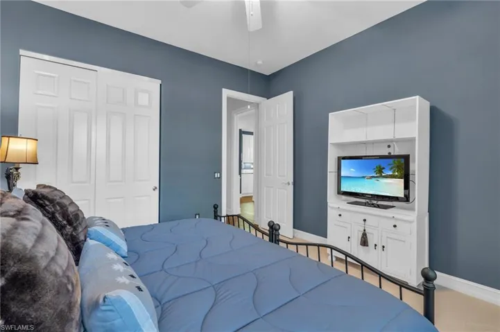 Bedroom featuring a closet and ceiling fan