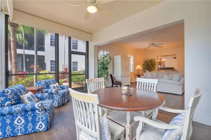 Dining area with hardwood / wood-style floors and ceiling fan