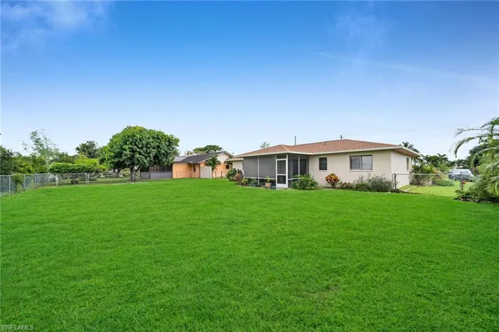 View of yard with a sunroom