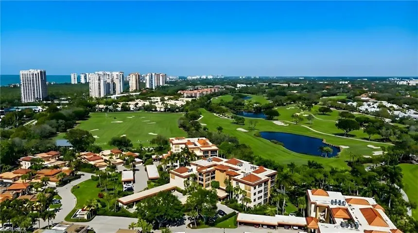 Bird's eye view of a local golf course and a large body of water