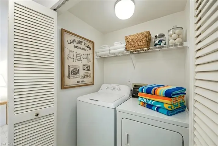 Laundry area with washing machine and clothes dryer