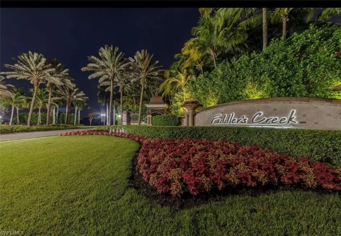 Community / neighborhood sign with a lawn