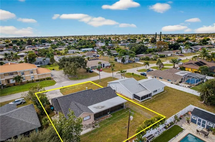 Aerial view of residential area with property boundaries highlighted