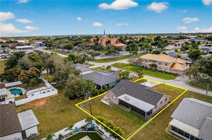 Aerial perspective of suburban area featuring property boundaries highlighted
