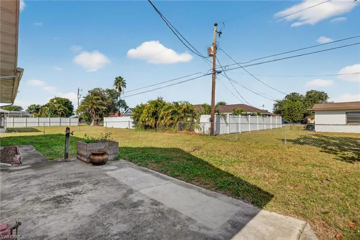 Fenced backyard featuring a patio