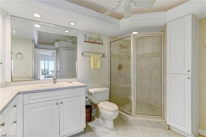 Main Bath: Custom tiled shower, raised vanities, corian counters,coffered ceilings, extra cabinetry