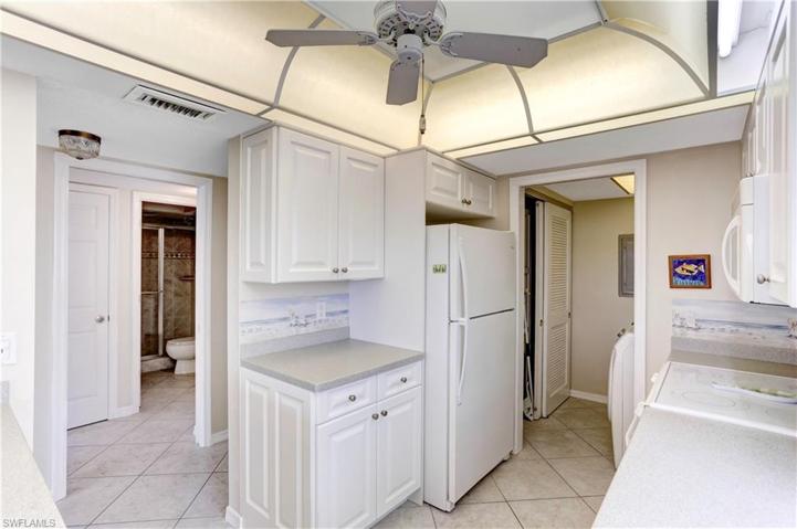 Separate laundry room off of the kitchen, extra cabinetry, and pantry.