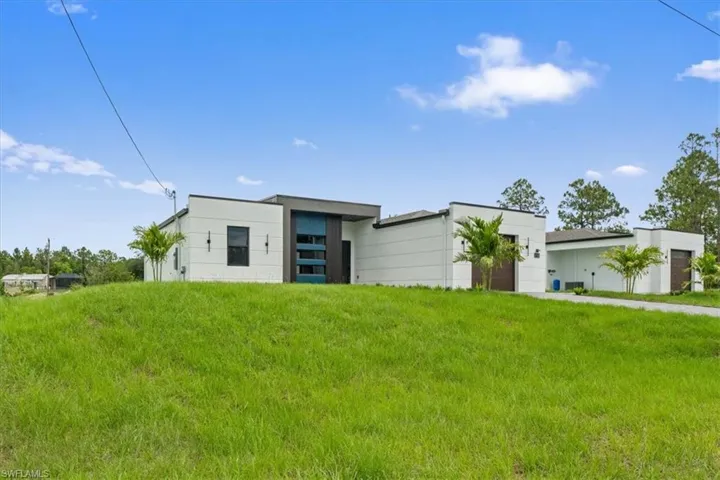 Contemporary home featuring a garage