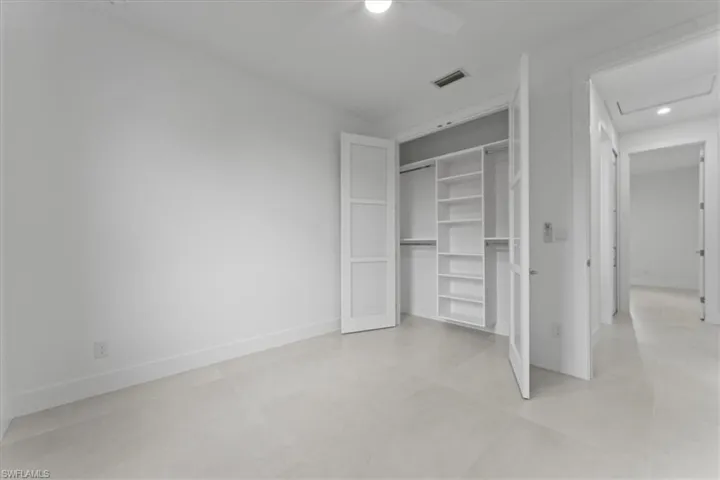 Unfurnished bedroom with a ceiling fan, a closet, and recessed lighting
