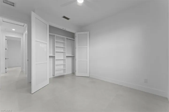 Unfurnished bedroom featuring a ceiling fan, a closet, and recessed lighting