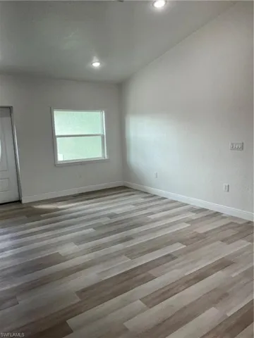 Unfurnished room featuring light wood-style flooring and recessed lighting