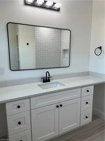 Bathroom featuring vanity and light wood-style flooring