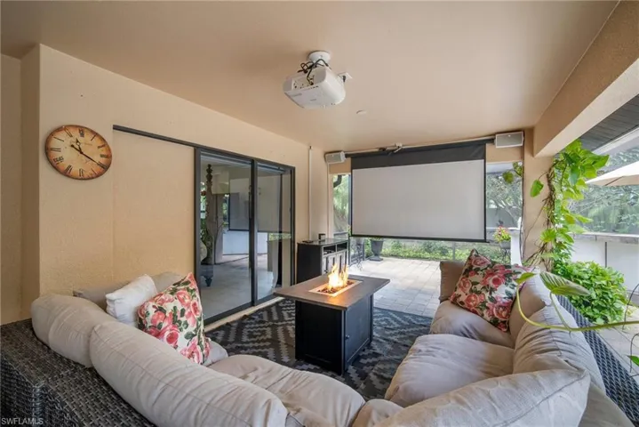 View of patio featuring an outdoor living space with a fire pit