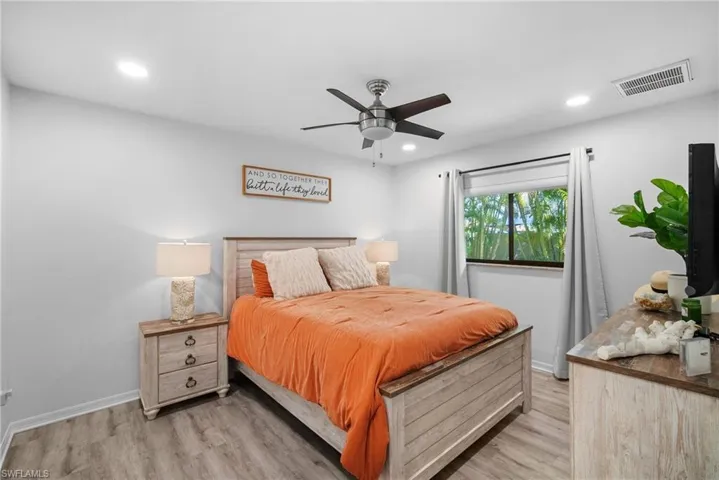 Bedroom with light wood-type flooring and ceiling fan