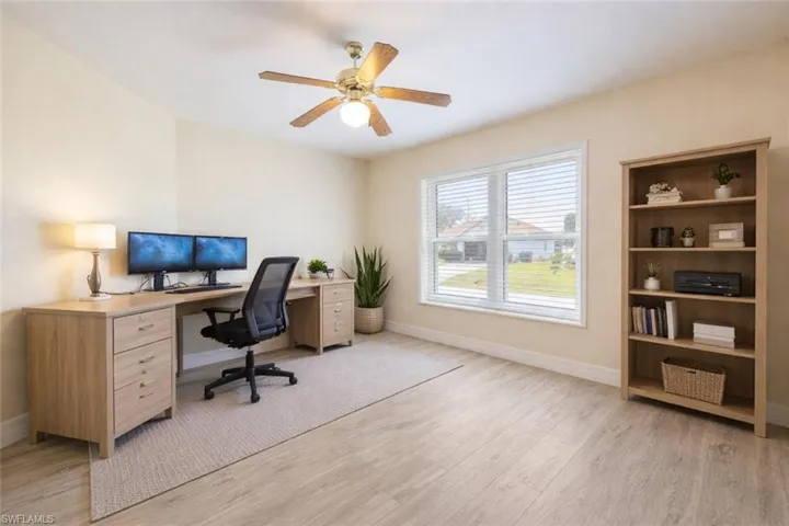 Office featuring light wood-style flooring and a ceiling fan