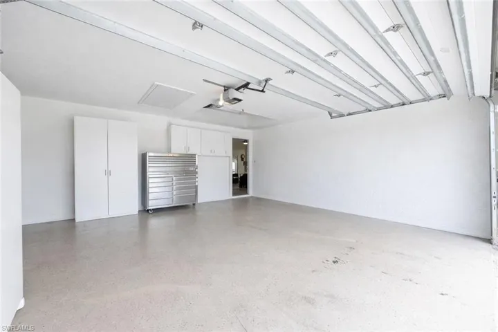 Garage featuring a garage door opener