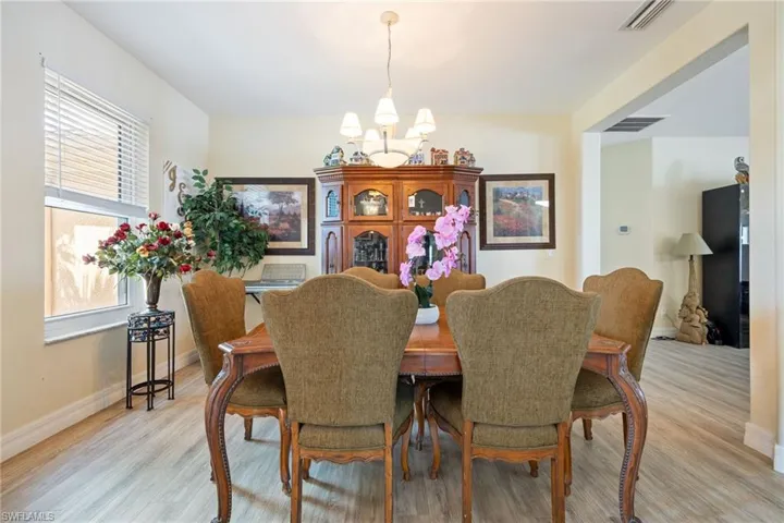 Dining room featuring a chandelier and light wood finished floors