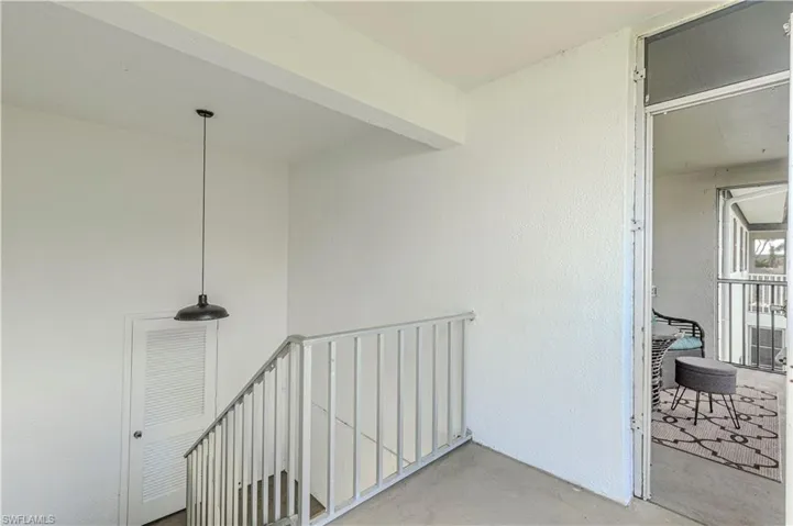 View of the staircase off the screened in lanai.