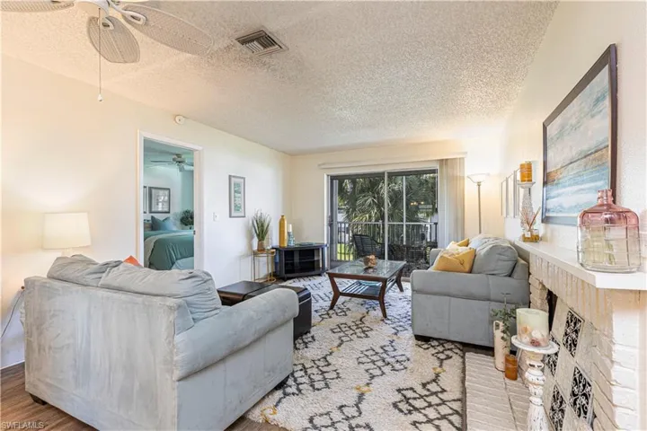 Living room featuring a fireplace and view.