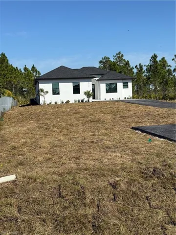 View of front of house with a front lawn