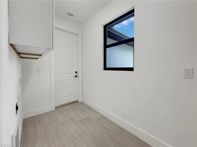 Washroom featuring light tile patterned floors