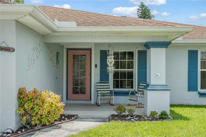 Property entrance with covered porch