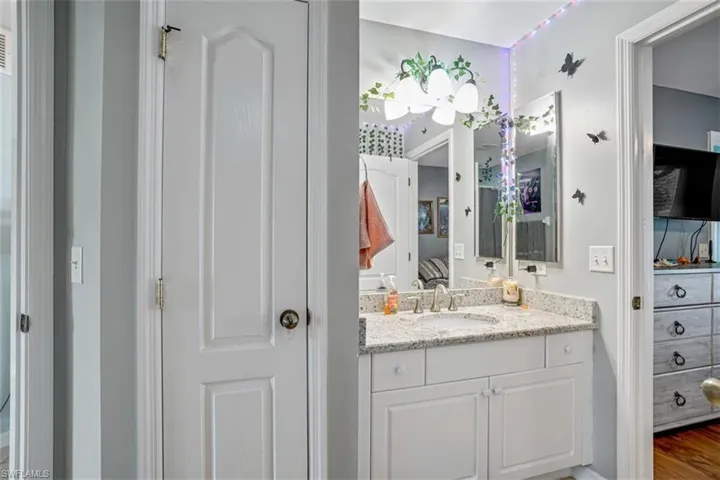 Bathroom featuring hardwood / wood-style flooring and vanity