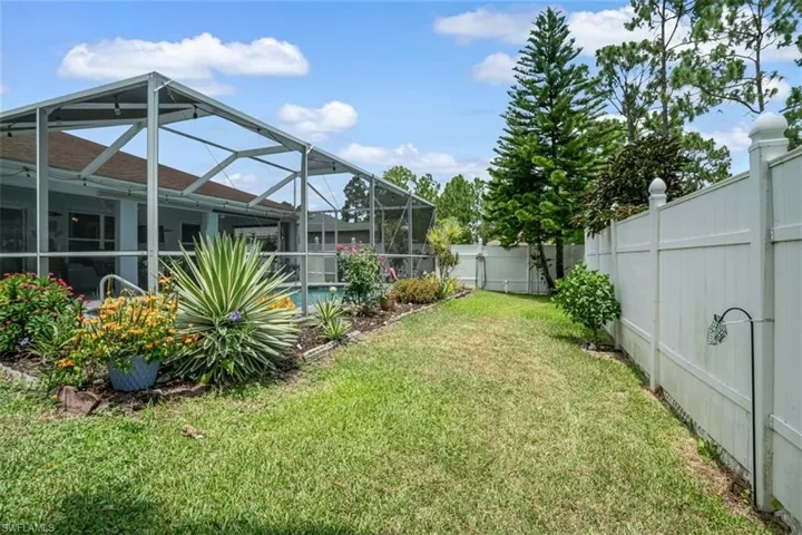 View of yard with a lanai