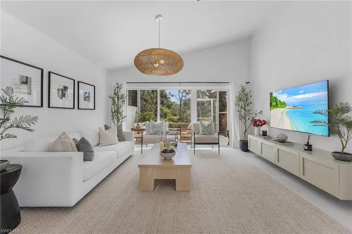 Living room with high vaulted ceiling