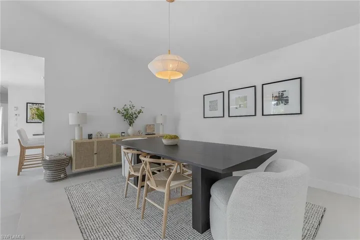 Dining area featuring light tile floors