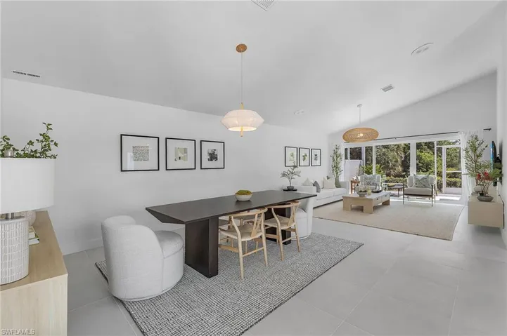 Tiled dining space with vaulted ceiling