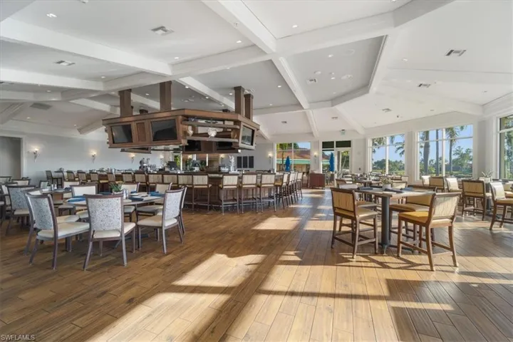 Dining space with beamed ceiling, hardwood / wood-style flooring, high vaulted ceiling, and recessed lighting