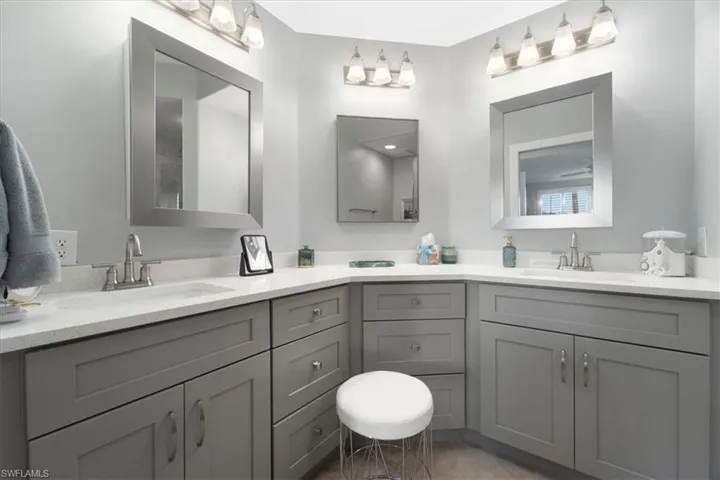 Full bath featuring double vanity
