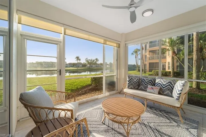 Sunroom with a water view and plenty of natural light