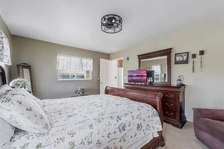 Bedroom with light tile patterned floors