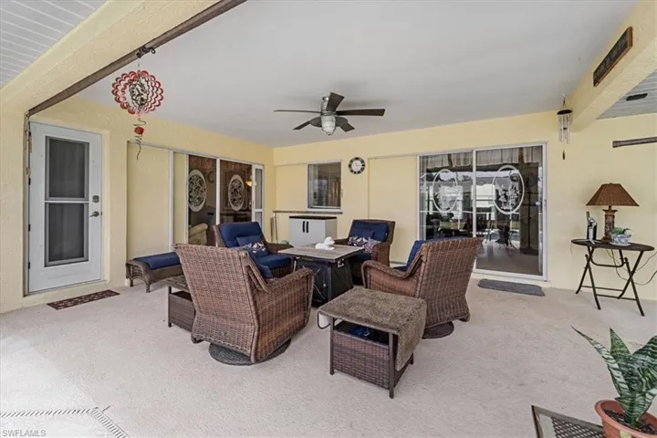 View of patio / terrace with a ceiling fan and an outdoor hangout area