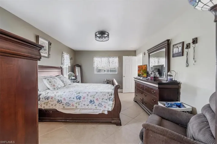 Bedroom with light tile patterned floors